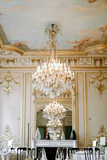 interior of elegant restaurant with golden ornaments and crystal chandelier