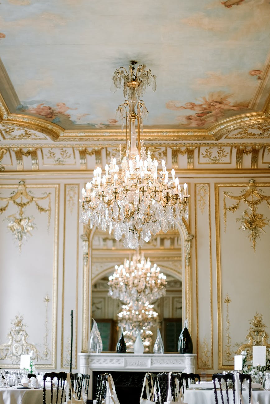 interior of elegant restaurant with golden ornaments and crystal chandelier