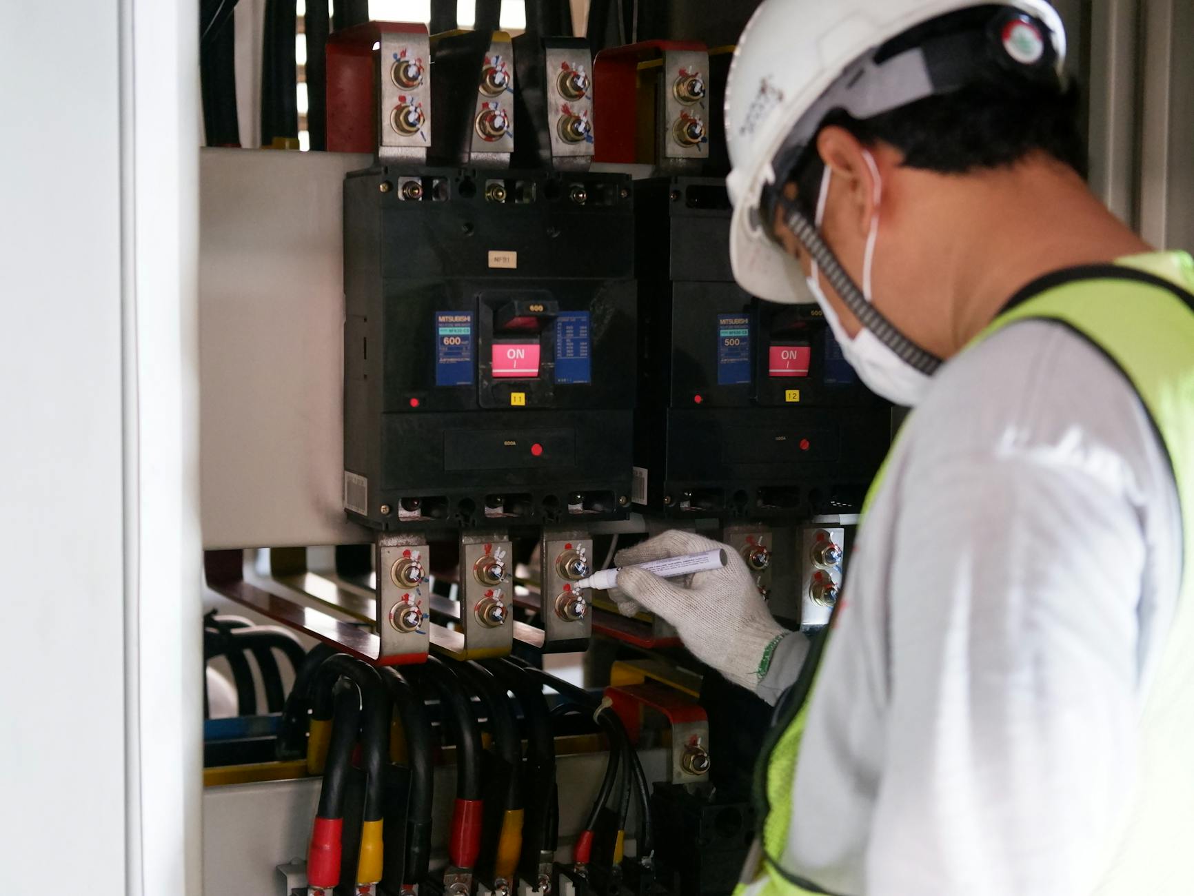 close up photo of a man checking a power voltage